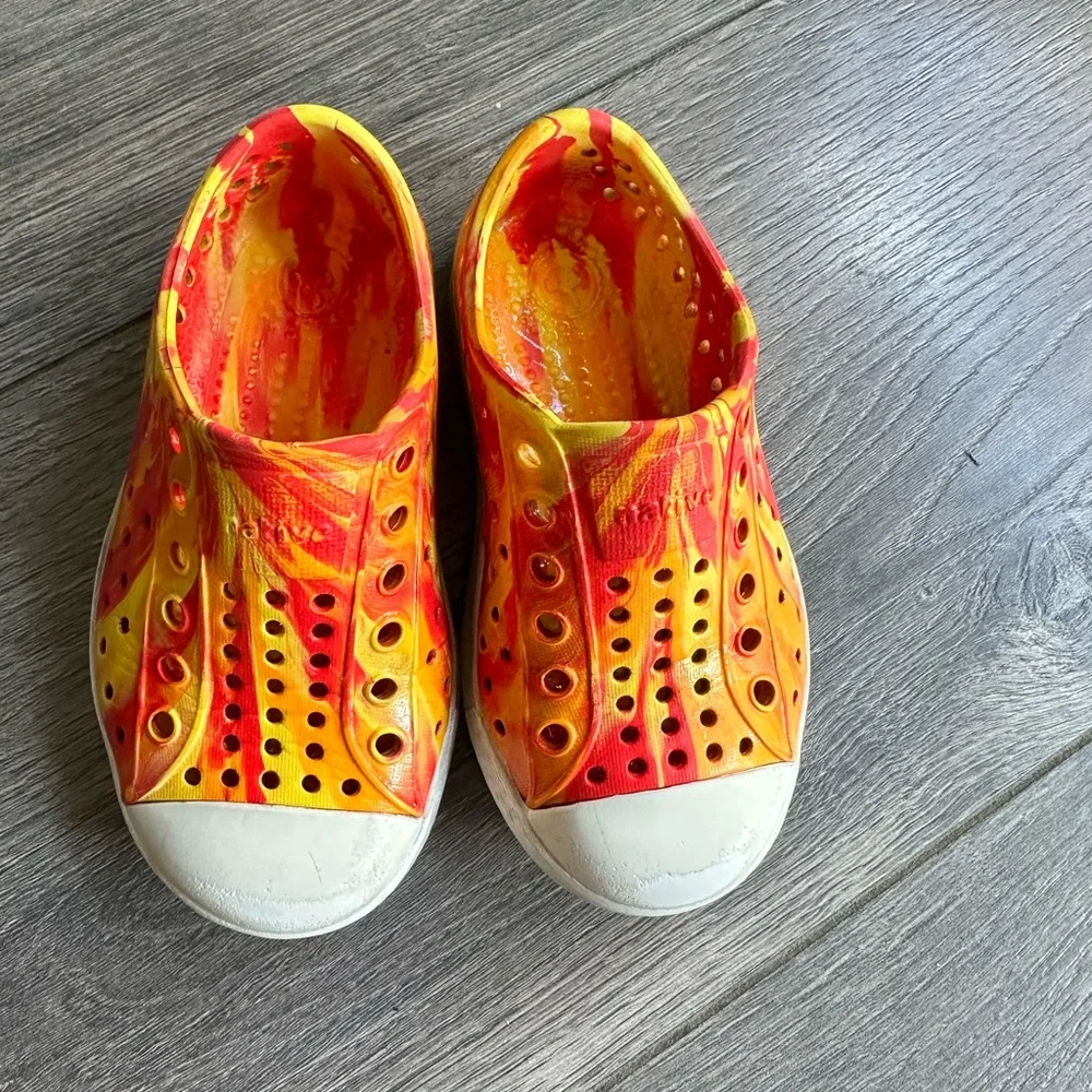 Unisex Native Shoes - yellow and orange tie-dye slip-on sneakers